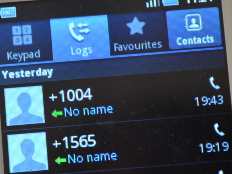 Phone scrren with call log, showing +1004 and +1565